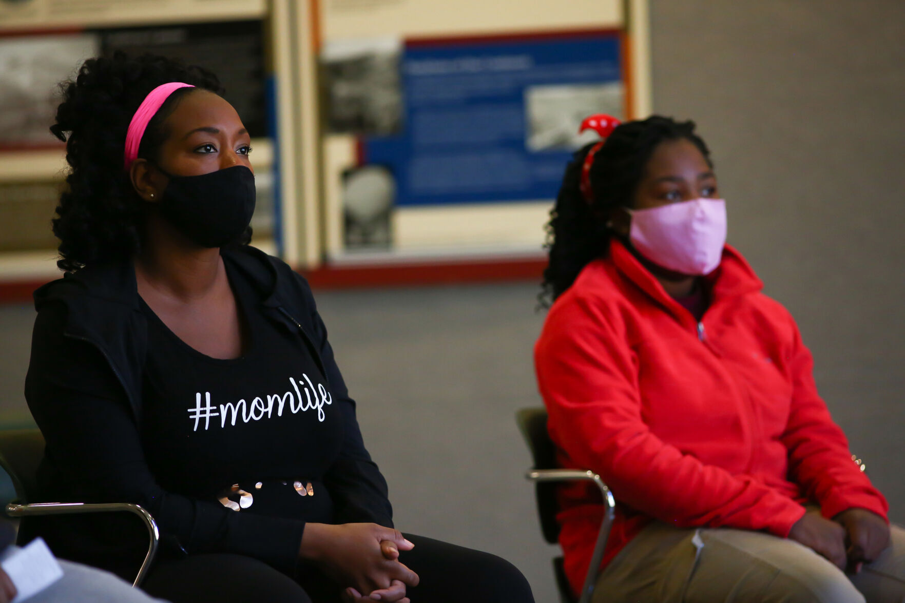 Jessica Newton, left, founder of Vibe Tribe Adventures, and her 14- year-old daughter, Joy Eloi, listen during first aid training at Bear Creek Regional Park in Colorado Springs, Colorado, on Oct. 24, 2020.
